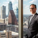 a powerful and confident attorney stands in a sleek, modern office, showcasing determination and expertise while the san antonio skyline is visible through the expansive windows, illuminated by warm, natural light.