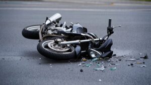 A damaged motorcycle on the road after accident