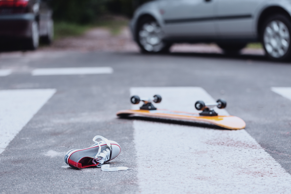 Skateboard and shoe left in a Houston crosswalk after a pedestrian was struck by a vehicle