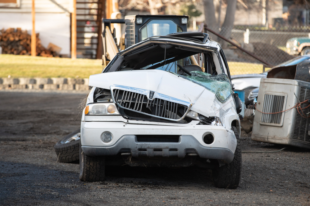 Badly damaged SUV with severe front-end destruction after a serious Houston SUV accident