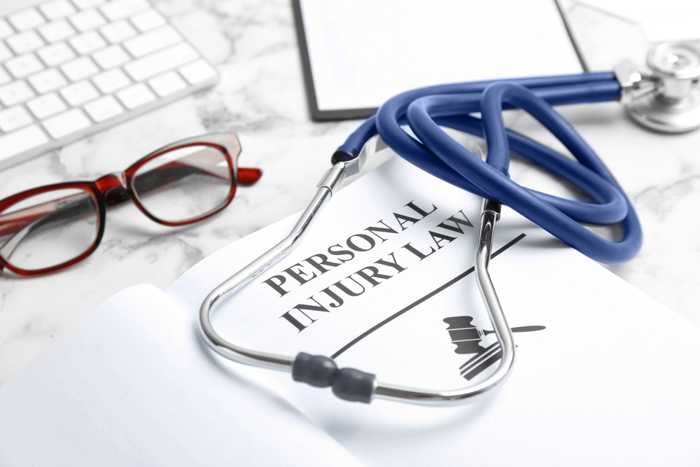 Stethoscope on a personal injury law document representing the need for a personal injury lawyer.